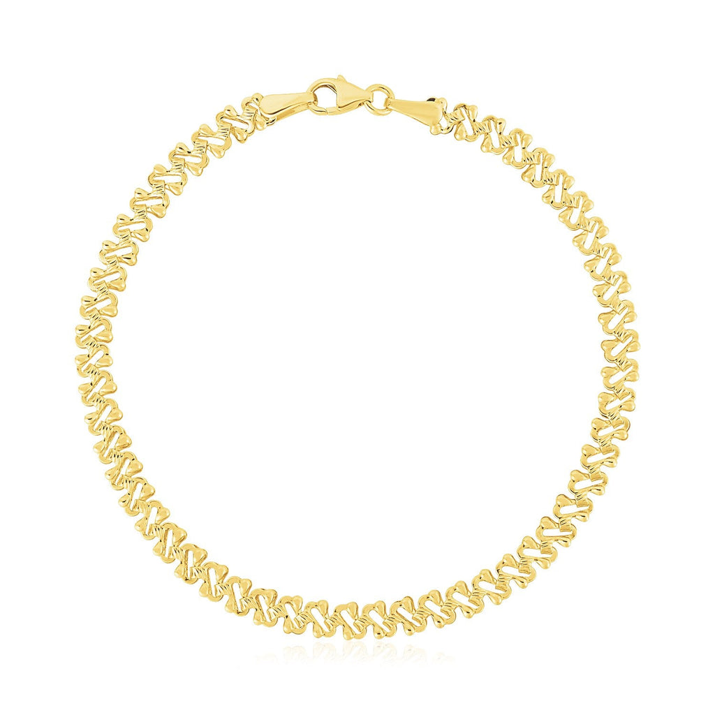 14k yellow gold textured fancy chain bracelet with a high polish finish, 4mm width, showcasing intricate link design.