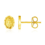 14k yellow gold oval religious medallion post earrings with detailed engraved design, crafted for elegant everyday wear.