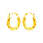 Polished 14k yellow gold oval hoop earrings, stylish jewelry for women, featuring smooth, shiny finish and classic hoop design.