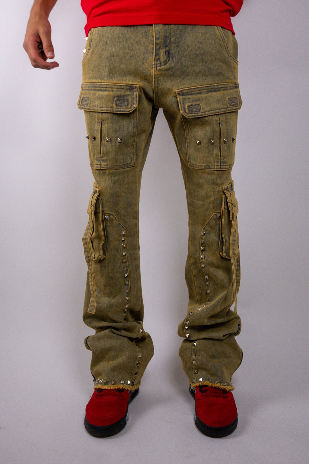 ARMOR JEANS RM206SK studded stacked cargo jeans with multiple pockets and metal stud embellishments, displayed on a hanger.