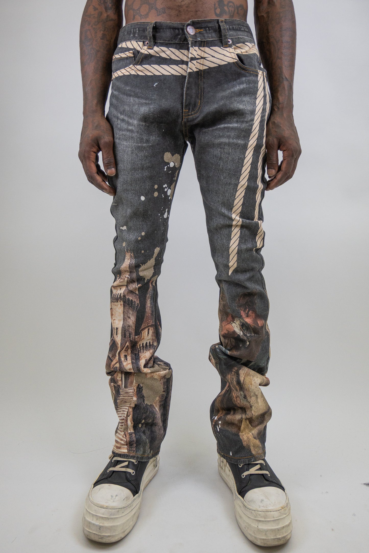 Graphic printed stacked jeans by Plush Fashion Hub, showing the stylish denim with unique graphic details and stacked design.