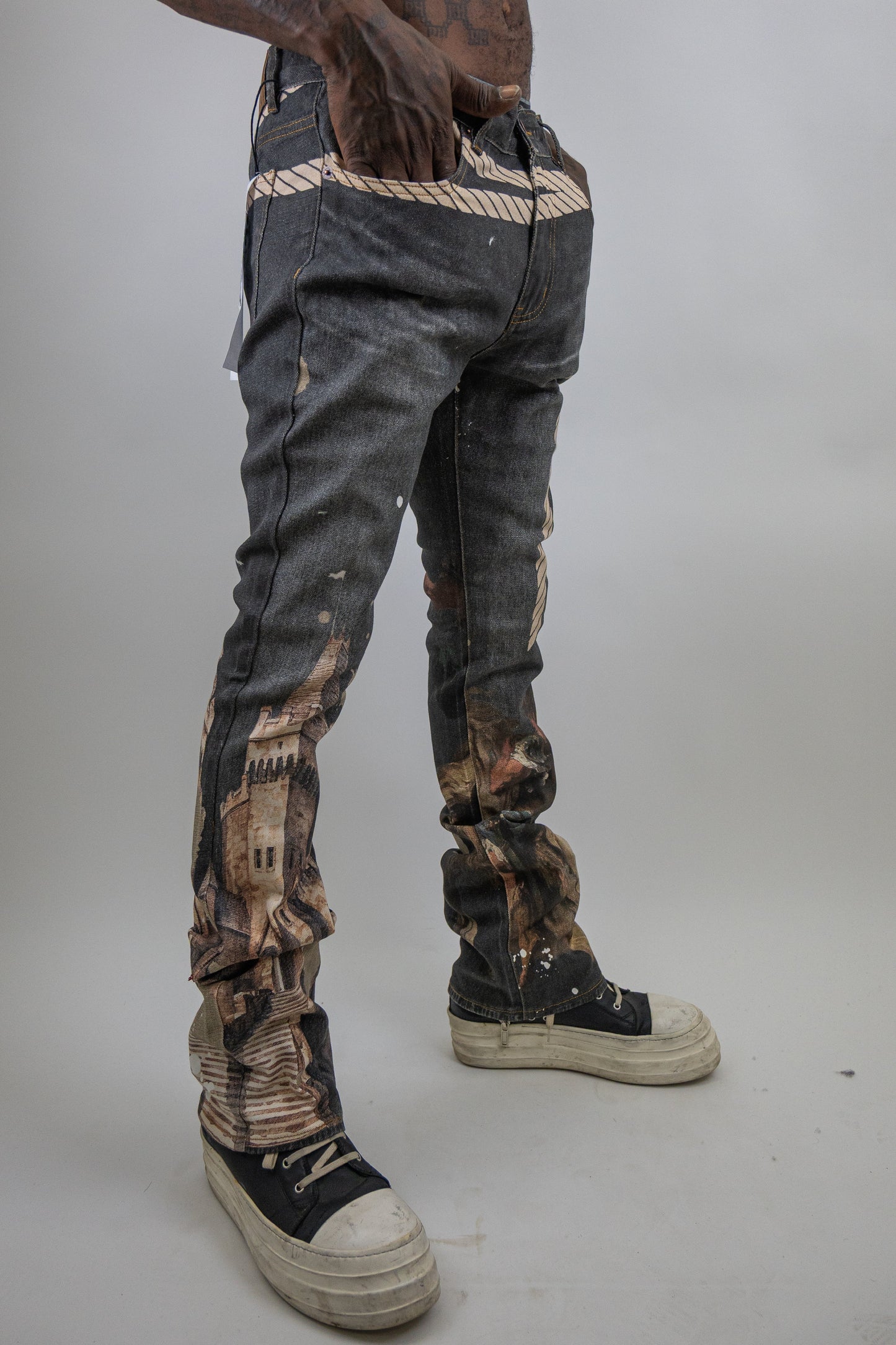 Stacked graphic printed jeans from Plush Fashion Hub featuring bold, colorful graphic designs on denim.