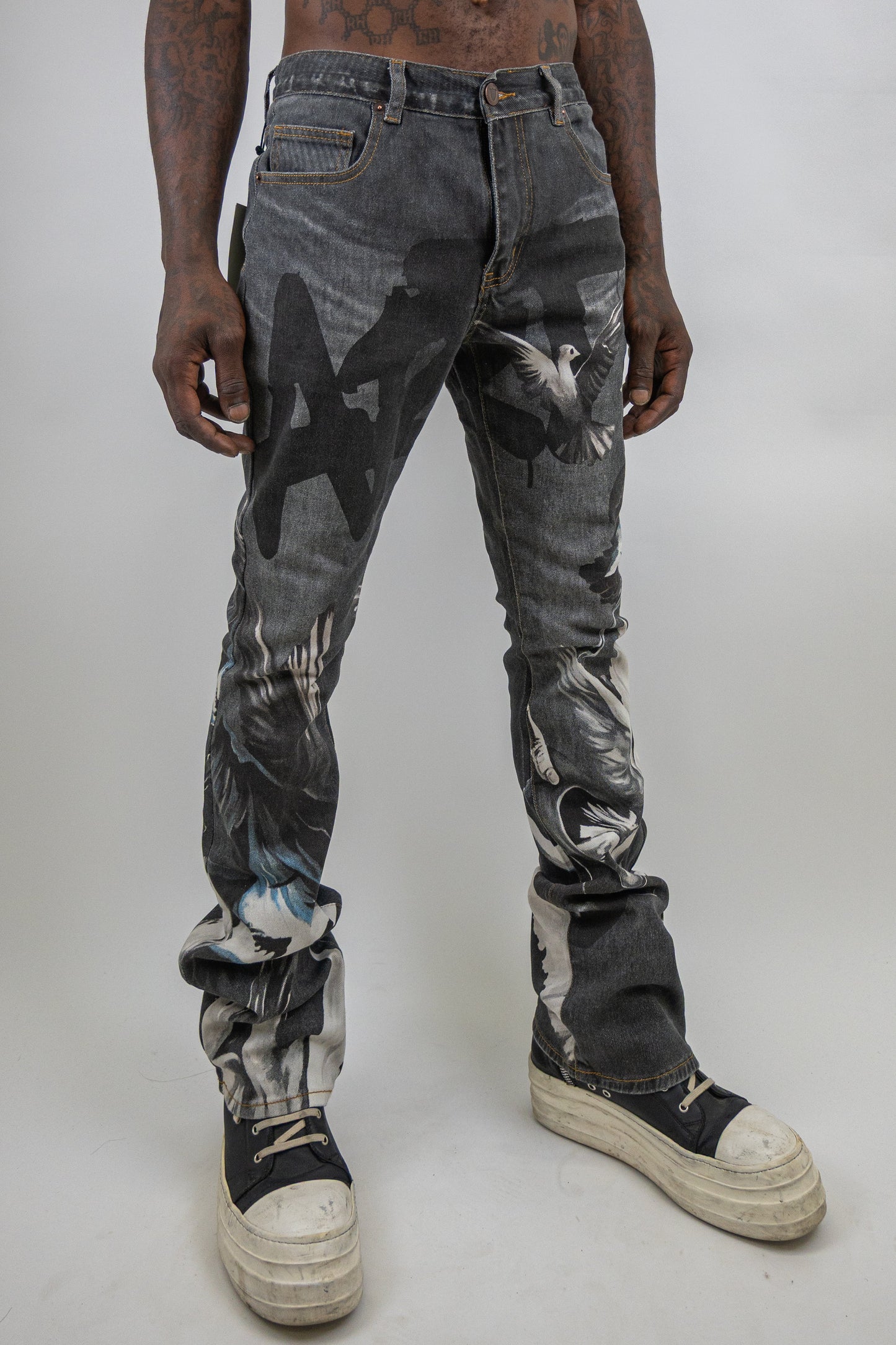 Stacked graphic printed jeans by Plush Fashion Hub showing a trendy design with bold patterns and a stacked fit style.