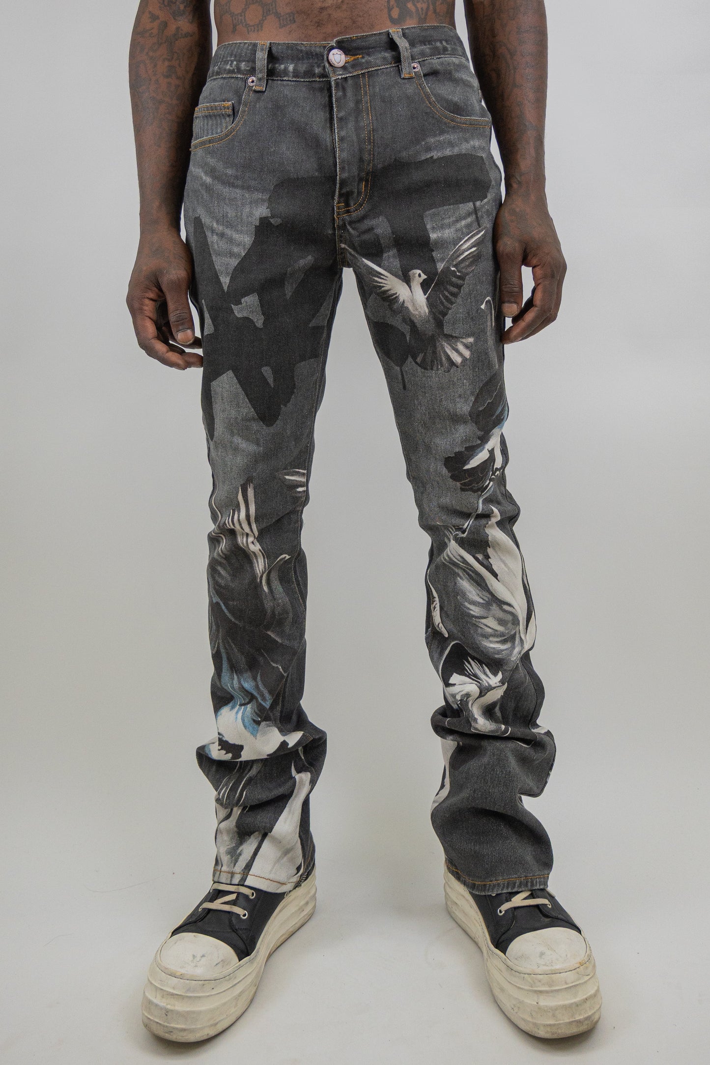 Stacked graphic printed jeans from Plush Fashion Hub featuring colorful, bold designs and a modern, trendy fit.