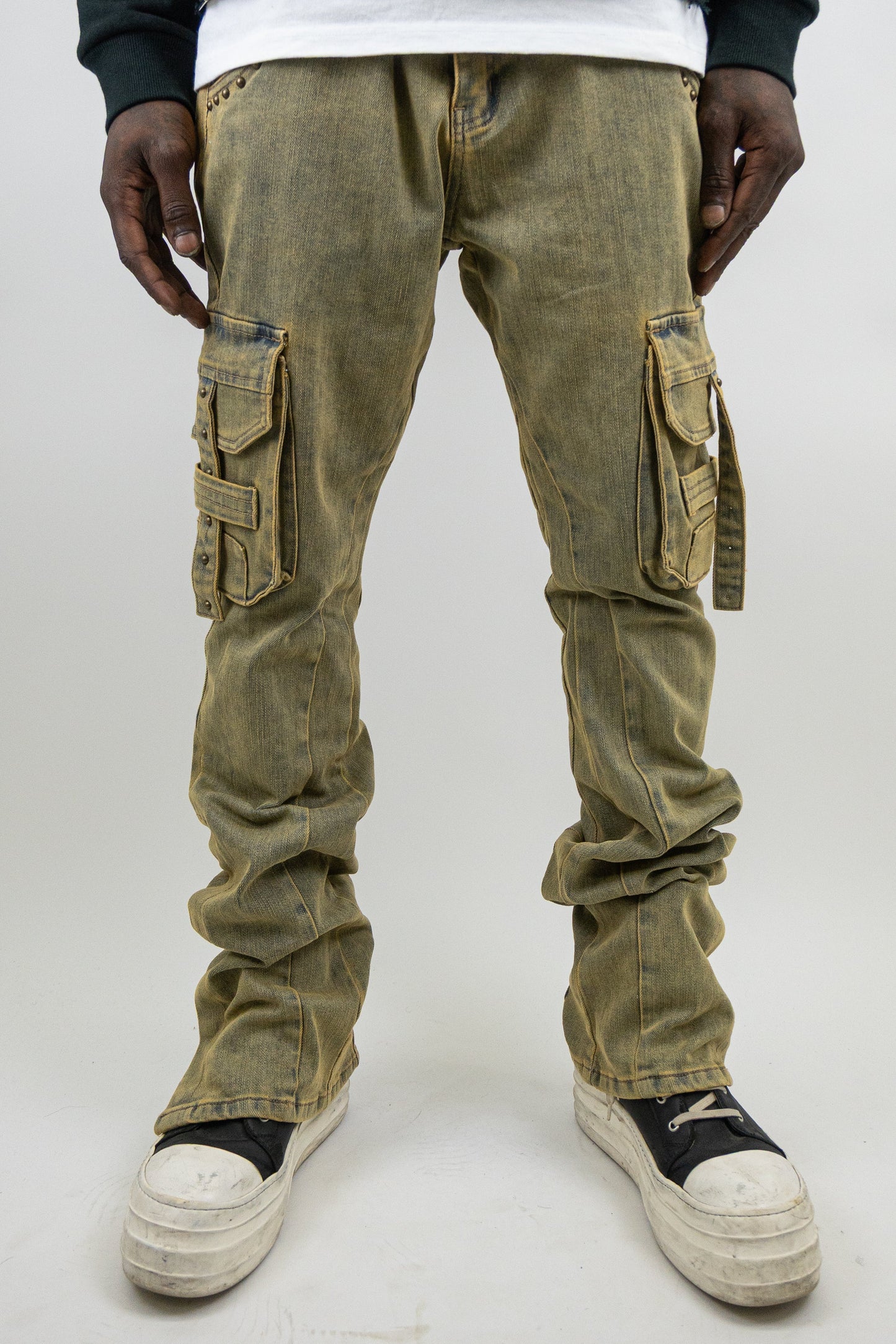 Black studded stacked cargo jeans from Plush Fashion Hub, featuring multiple pockets and distressed details.