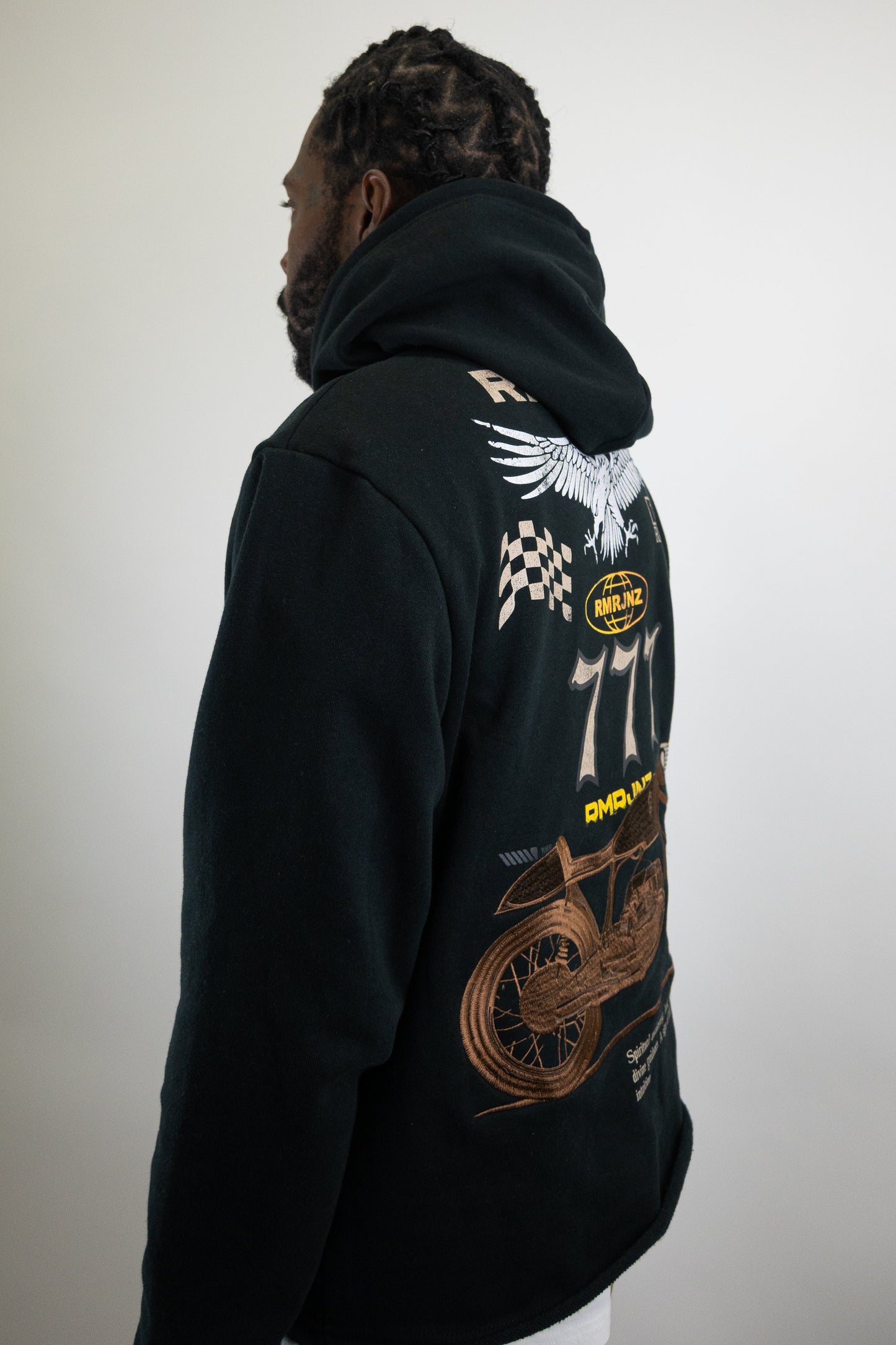 Plush Fashion Hub RM1181C Moto Cropped Hoodie, stylish black outerwear with a fitted design, displayed on a hanger.