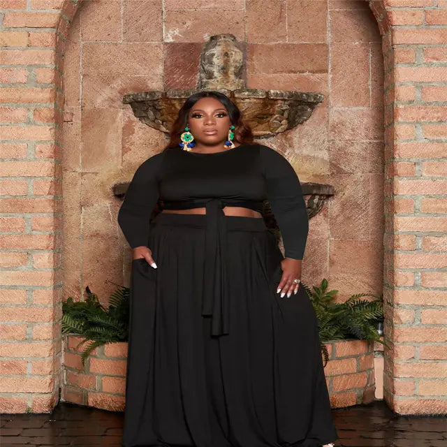 Plus size women's two-piece skirt set with long sleeves, featuring a stylish, form-fitting design from Plush Fashion Hub.