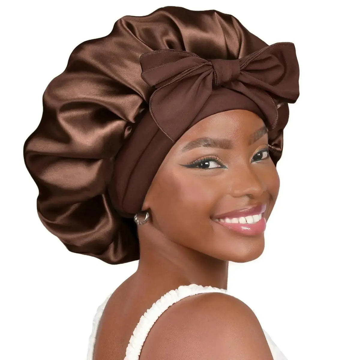 Double-layer satin ribbon hair bonnet for sleep protection, plush satin fabric with a decorative bow, by Plush Fashion Hub.