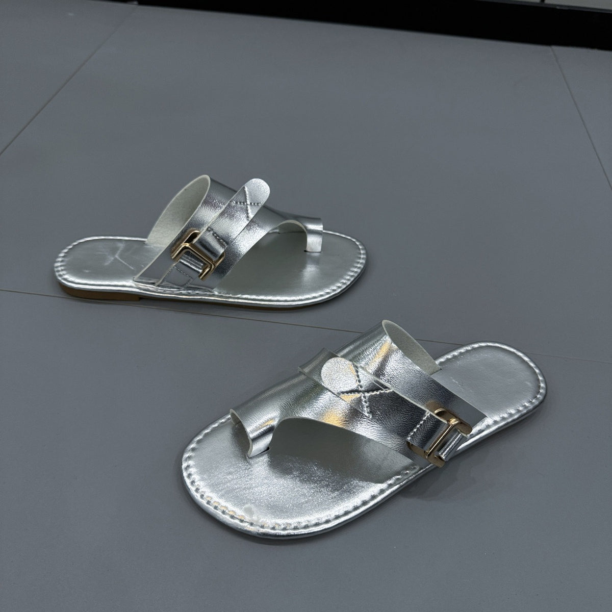 Elegant Plush Fashion Hub closed-toe flat sandals with sleek design, featuring a comfortable fit and stylish look.