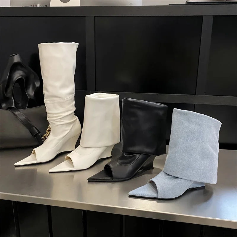 Four pairs of elegant peep-toe wedge boots in white, black, and light blue, featuring slouchy shafts and pointed toes.