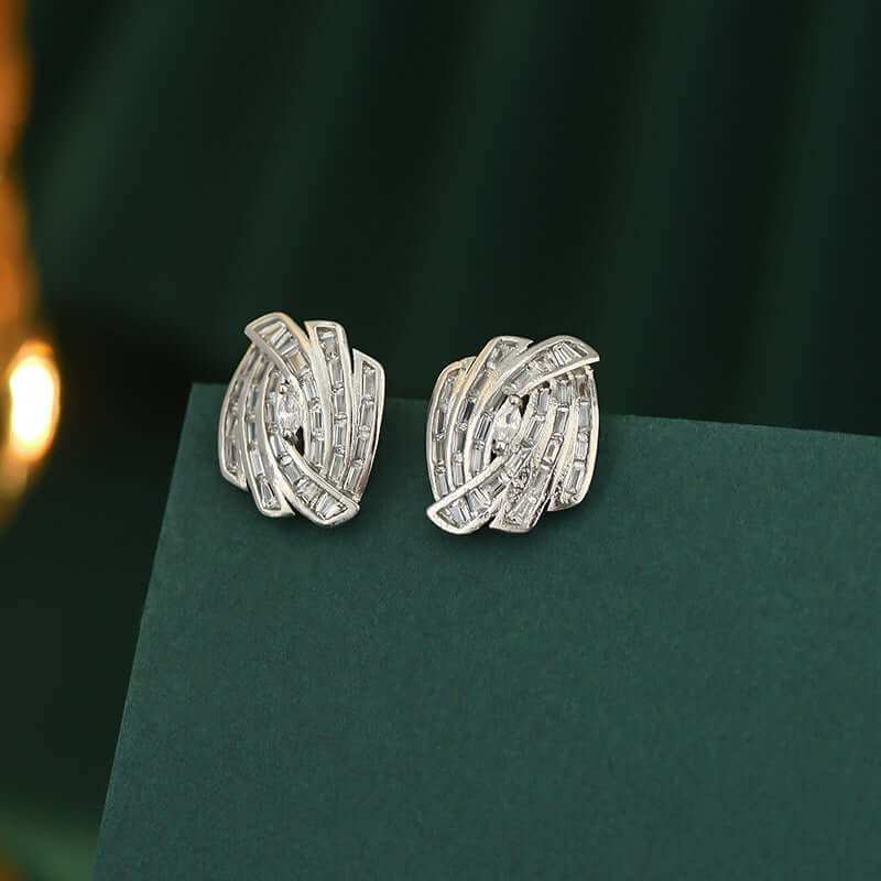 Elegant Micro Zircon stud earrings in geometric design with electroplated silver tone.