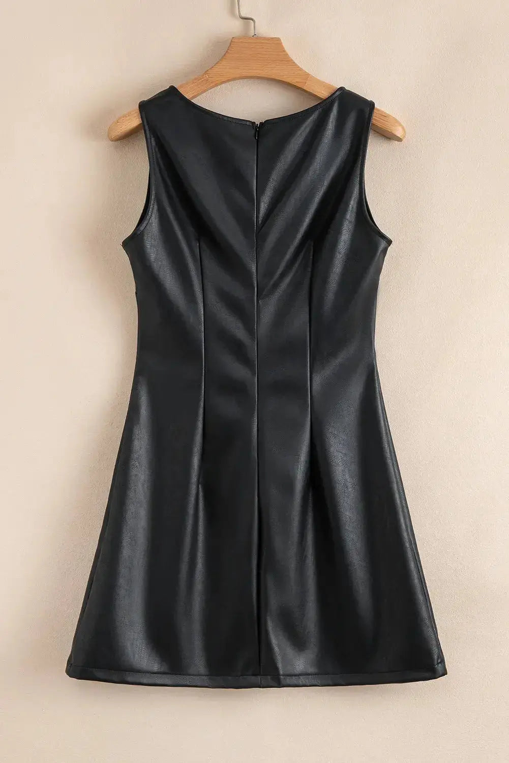 Emelia leather sleeveless mini dress by Threaded Pear, showcasing fitted silhouette and sleek black leather material.