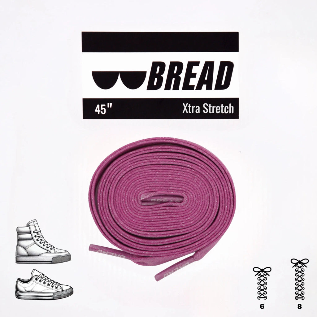 Pink elastic shoelace by Bread, shown in close-up with flexible, stretchy material and vibrant pink color.