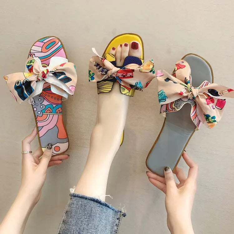 Women's summer flat slippers with bow detail, stylish Trendy Attic Store01 sandals, perfect for casual warm-weather wear.