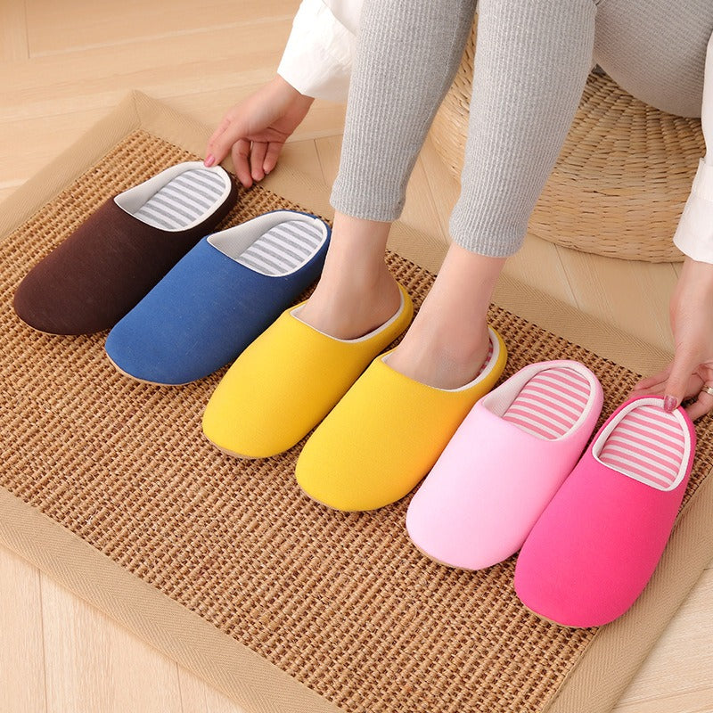 Minimalist soft cotton indoor slippers in brown, blue, yellow, light pink, and magenta with striped patterned insoles.