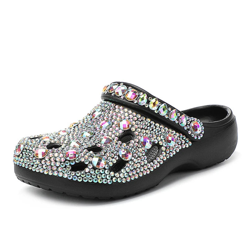 Black slip-on clog sandal featuring iridescent, multi-sized rhinestones covering the entire upper and strap.