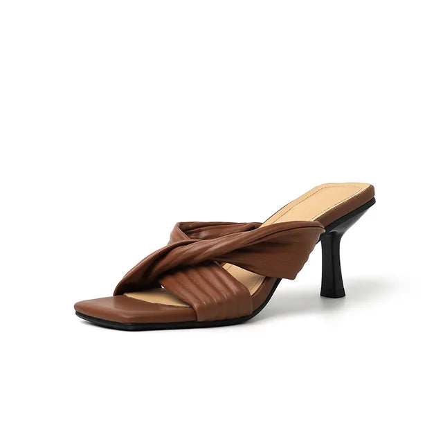 Elegant square-toe stiletto heels with crisscross straps from Plush Fashion Hub, showcasing stylish footwear design.