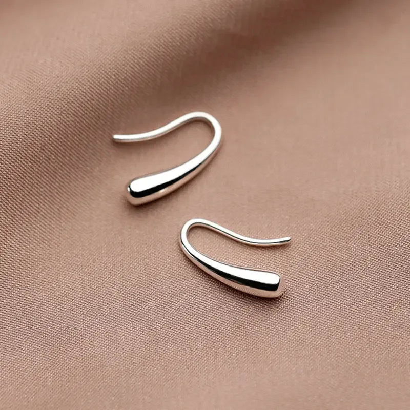 Minimalist lightweight sterling silver drop earrings with a simple elegant design for women.