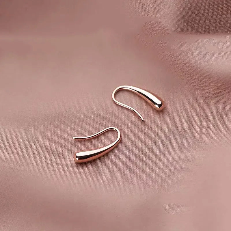 Minimalist lightweight sterling silver drop earrings for women, featuring sleek and simple design from Plush Fashion Hub.
