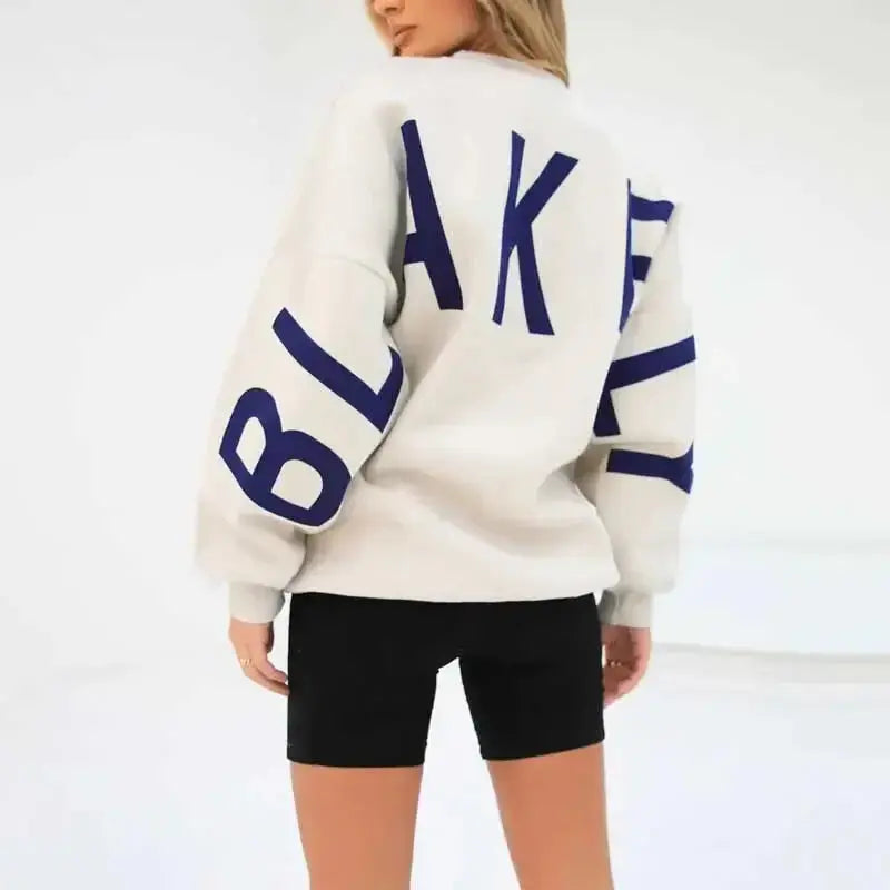 Oversized Plush Fashion Hub long sleeve sweatshirt with bold graphic print, cozy urban pullover for casual wear.