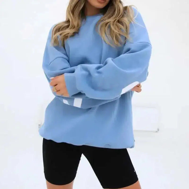 Oversized long sleeve sweatshirt with bold graphic print from Plush Fashion Hub, cozy and loose urban pullover for casual wear.