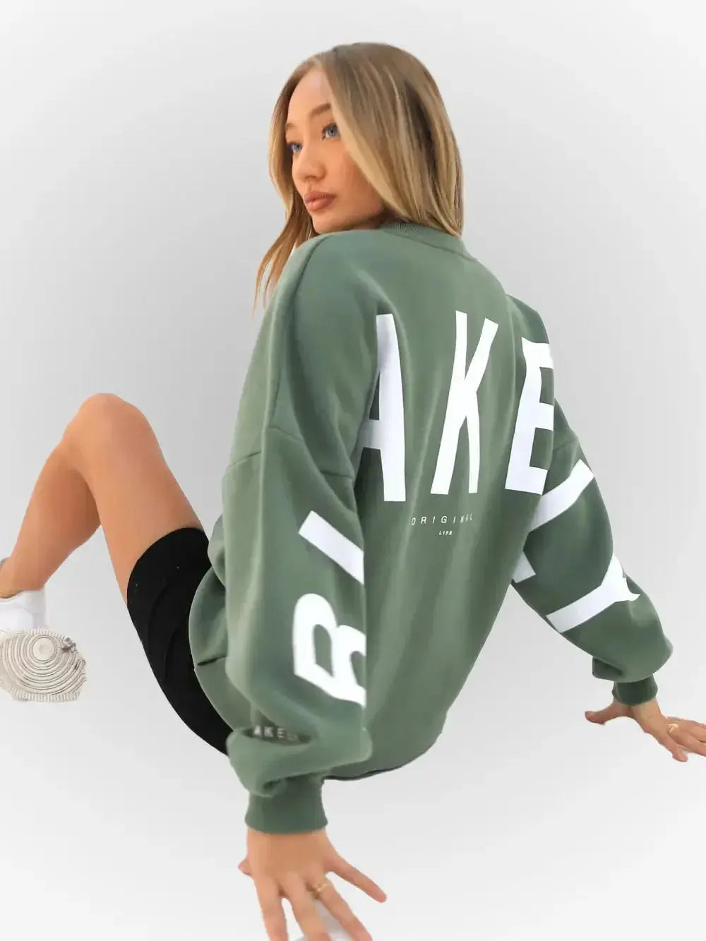 Oversized graphic print long sleeve sweatshirt by Plush Fashion Hub, cozy urban pullover with thick fabric and relaxed fit.
