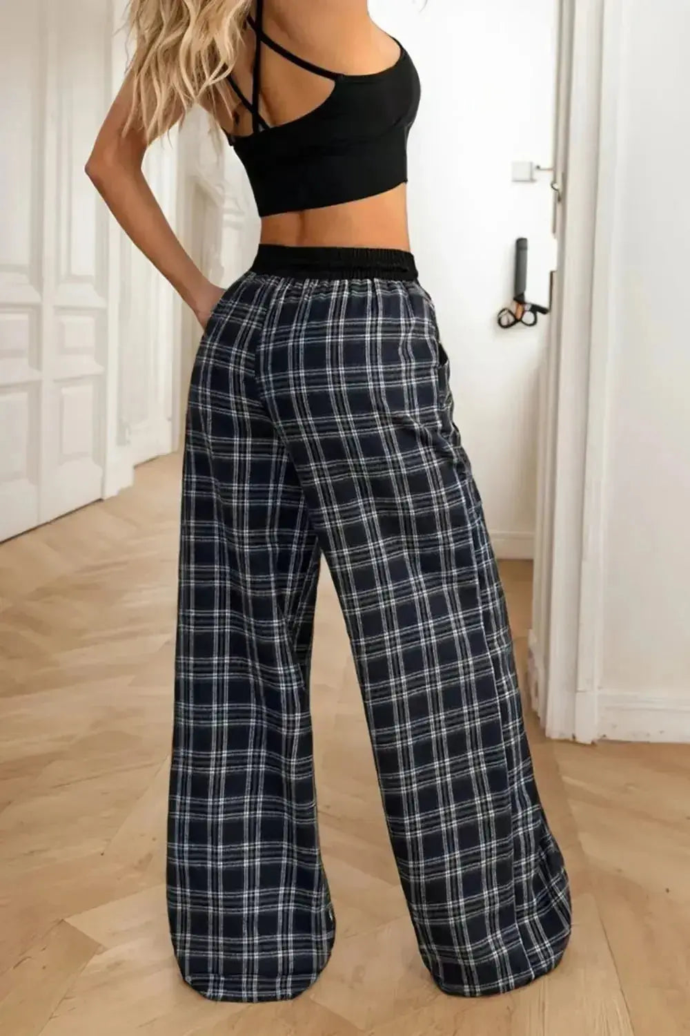 Women’s high-waisted plaid flannel wide-leg pants from Plush Fashion Hub, featuring a cozy flannel fabric and relaxed fit.
