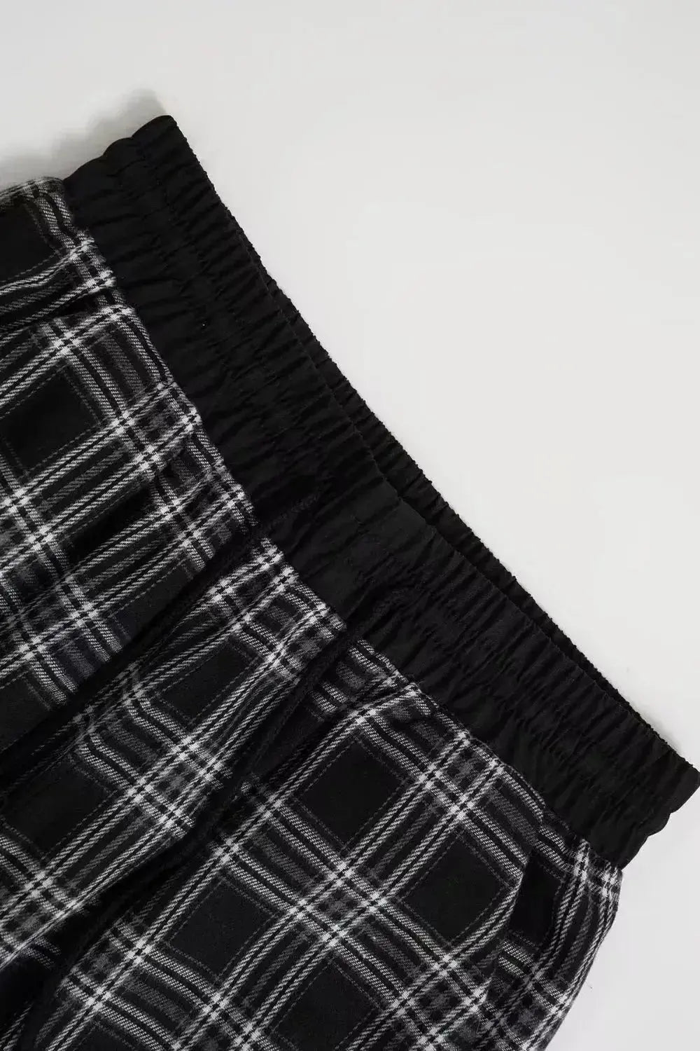 Women’s high-waisted plaid flannel wide-leg trousers from Plush Fashion Hub, featuring a soft flannel fabric and relaxed fit.