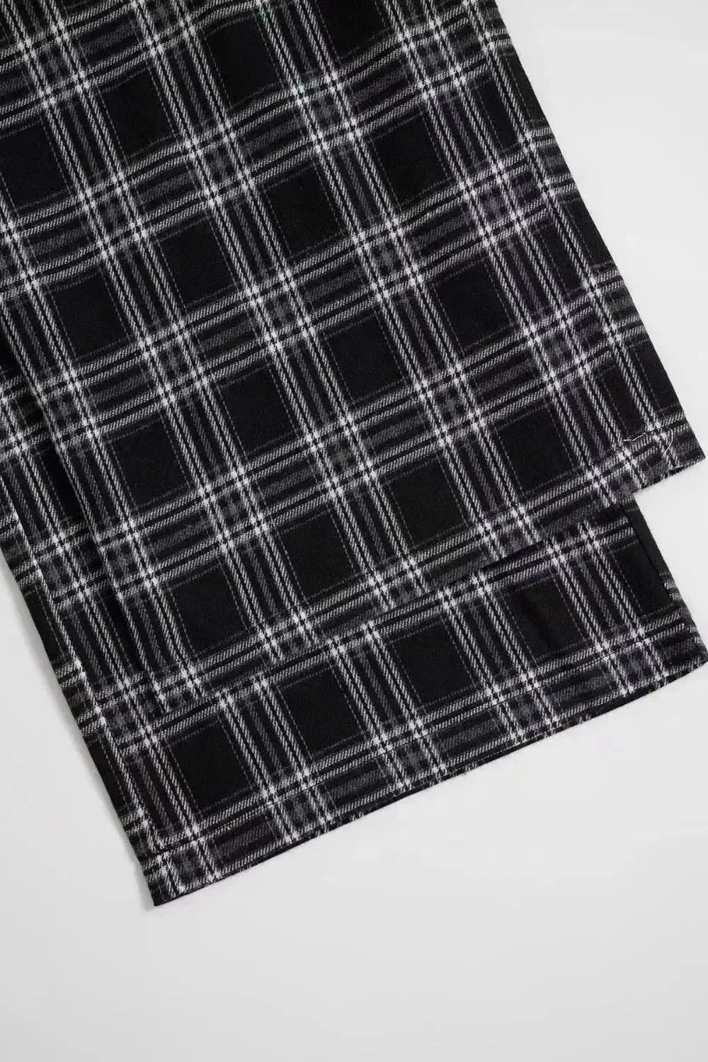 Women’s high-waisted plaid flannel wide-leg trousers from Plush Fashion Hub, featuring a relaxed fit and classic plaid pattern.