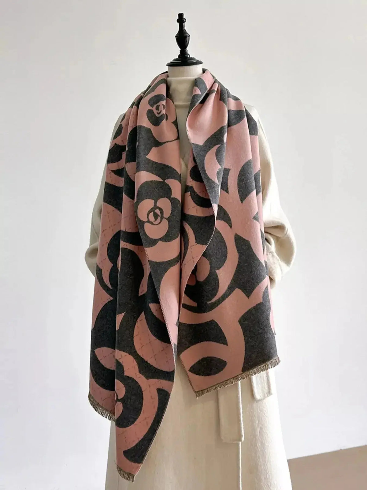 Floral patterned winter scarf from Plush Fashion Hub, soft and cozy for autumn warmth and stylish accessory.
