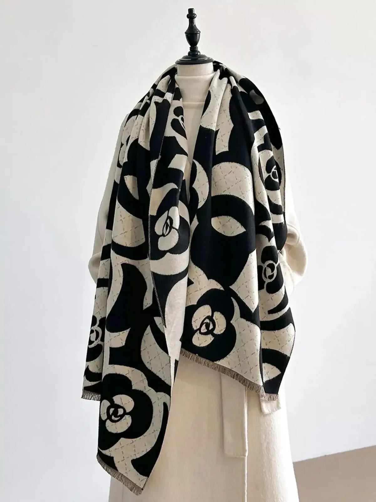 Floral patterned winter scarf by Plush Fashion Hub, soft and cozy for warmth during autumn and winter.
