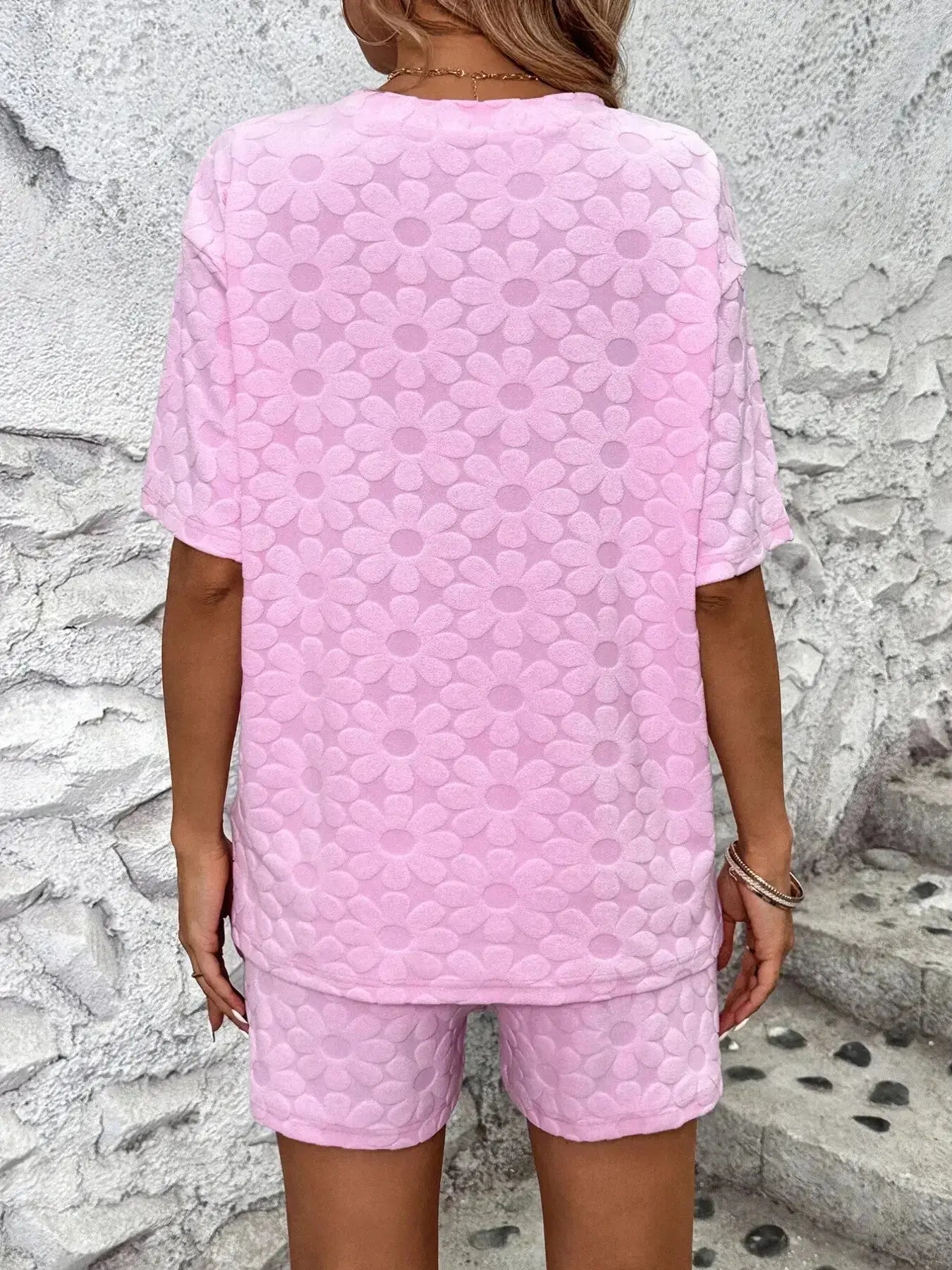 Floral print round neck top and shorts lounge pajamas set by Trendsi, featuring a cozy, stylish design perfect for relaxed wear.