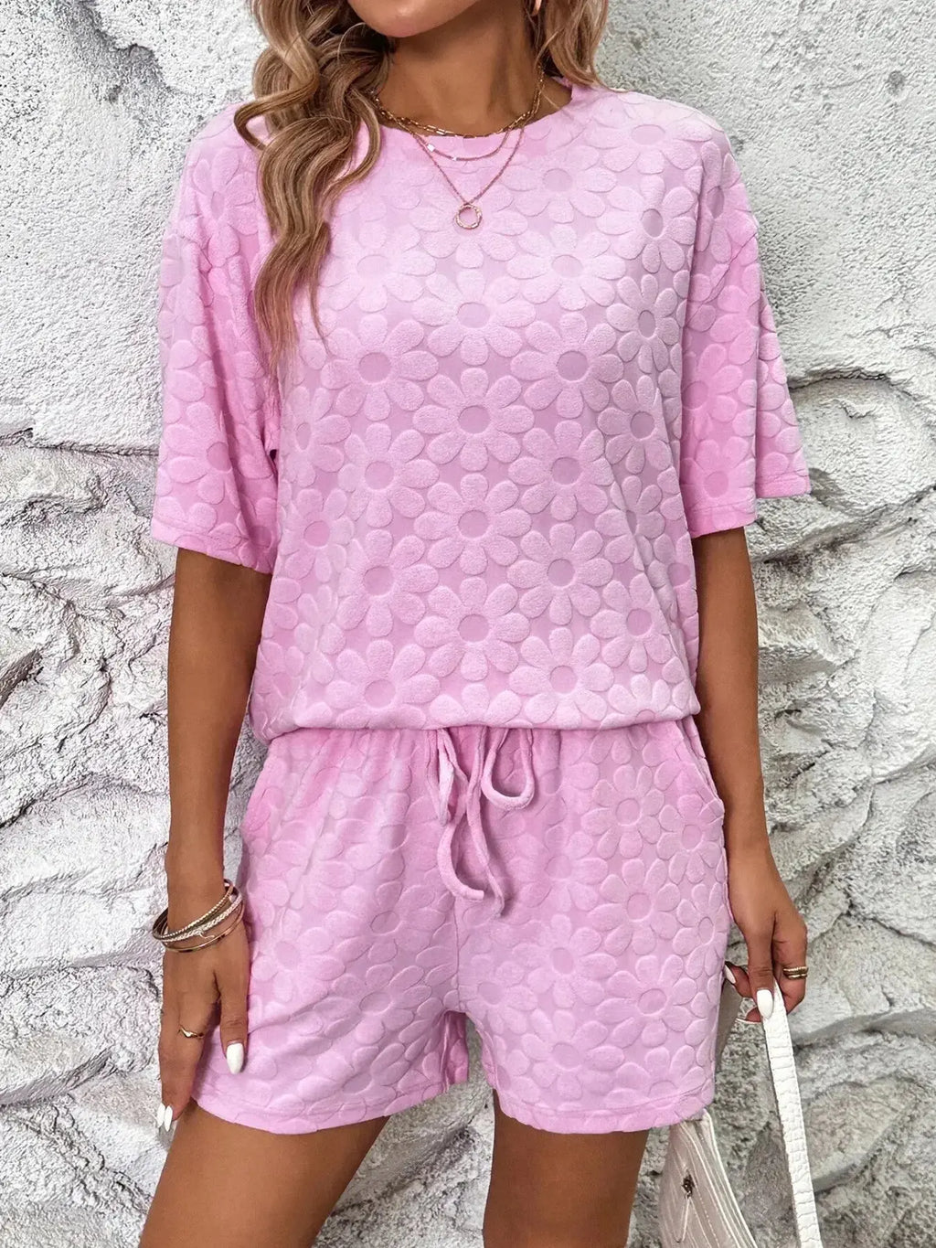 Floral print round neck top and matching shorts lounge pajamas set by Trendsi, featuring soft fabric and comfortable fit.