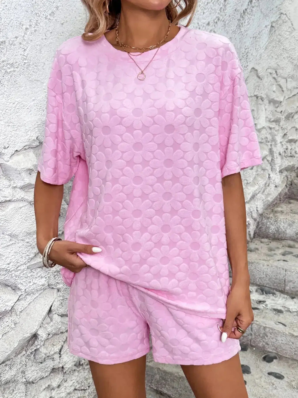 Floral print round neck top and shorts pajama set by Trendsi, soft lounge set with vibrant floral design and comfortable fit.