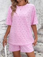 Floral print round neck top and shorts lounge set by Trendsi, soft pajamas with vibrant floral pattern and comfortable fit.