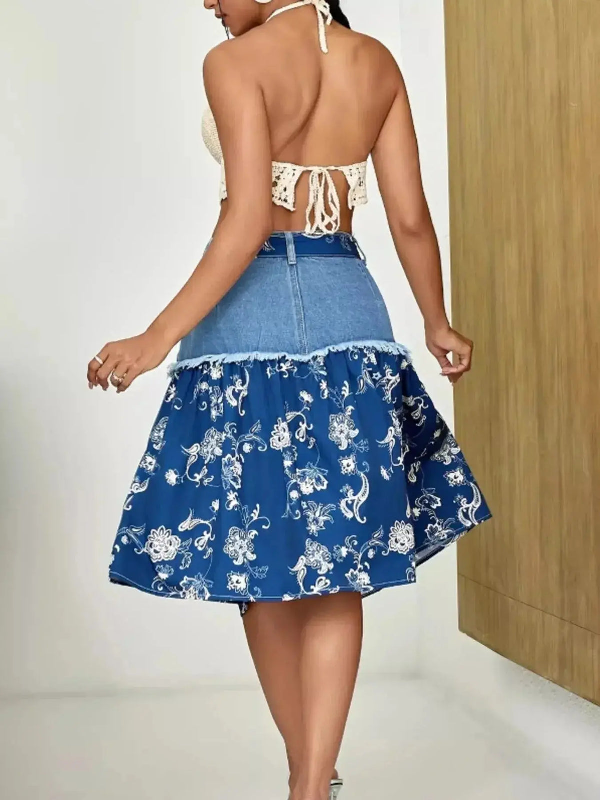 Floral print tiered denim skirt with frayed hem by Plush Fashion Hub, showcasing a stylish, flowy design perfect for casual wear.