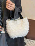 Soft faux fur shoulder bag from Trendsi with a fluffy plush design, lightweight and perfect for casual or evening use.