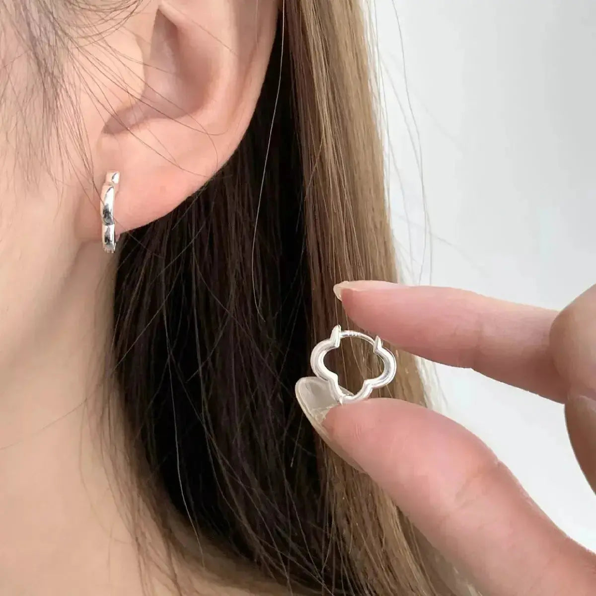 Sterling silver four-leaf clover stud earrings, lucky jewelry by Plush Fashion Hub, featuring detailed clover leaf design.