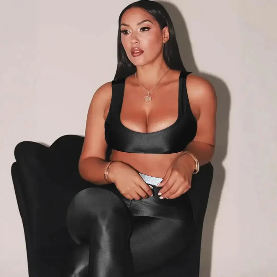 Shiny black Plush Fashion Hub stretch leggings with a high-gloss finish, shown from the front on a model.