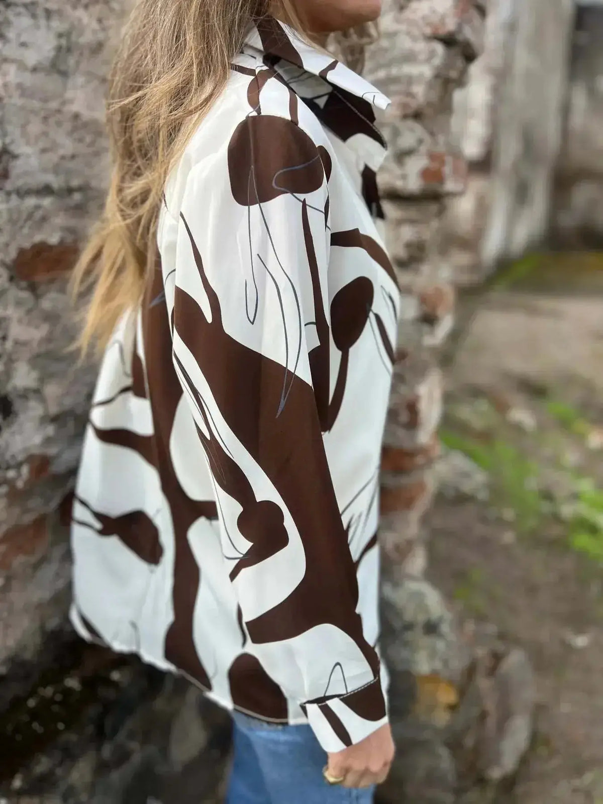 Plus size women's abstract print long sleeve button-up shirt by Plush Fashion Hub, featuring vibrant, stylish design.