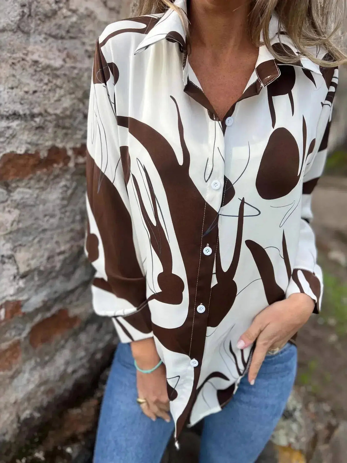 Plus size women's abstract print long sleeve button-up shirt by Plush Fashion Hub, featuring vibrant, stylish design and comfortable fit.