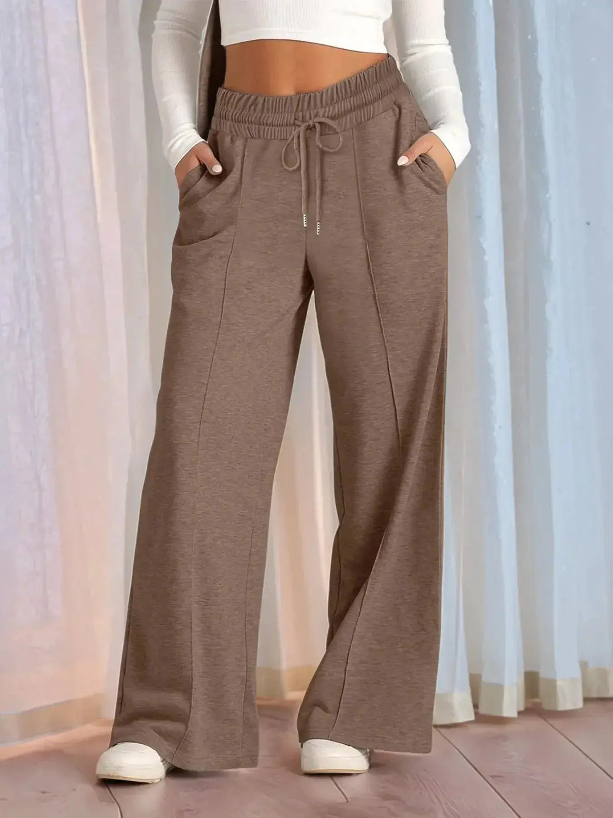 Plus-size women's relaxed fit wide leg lounge pants with drawstring waist from Plush Fashion Hub, shown in full length.