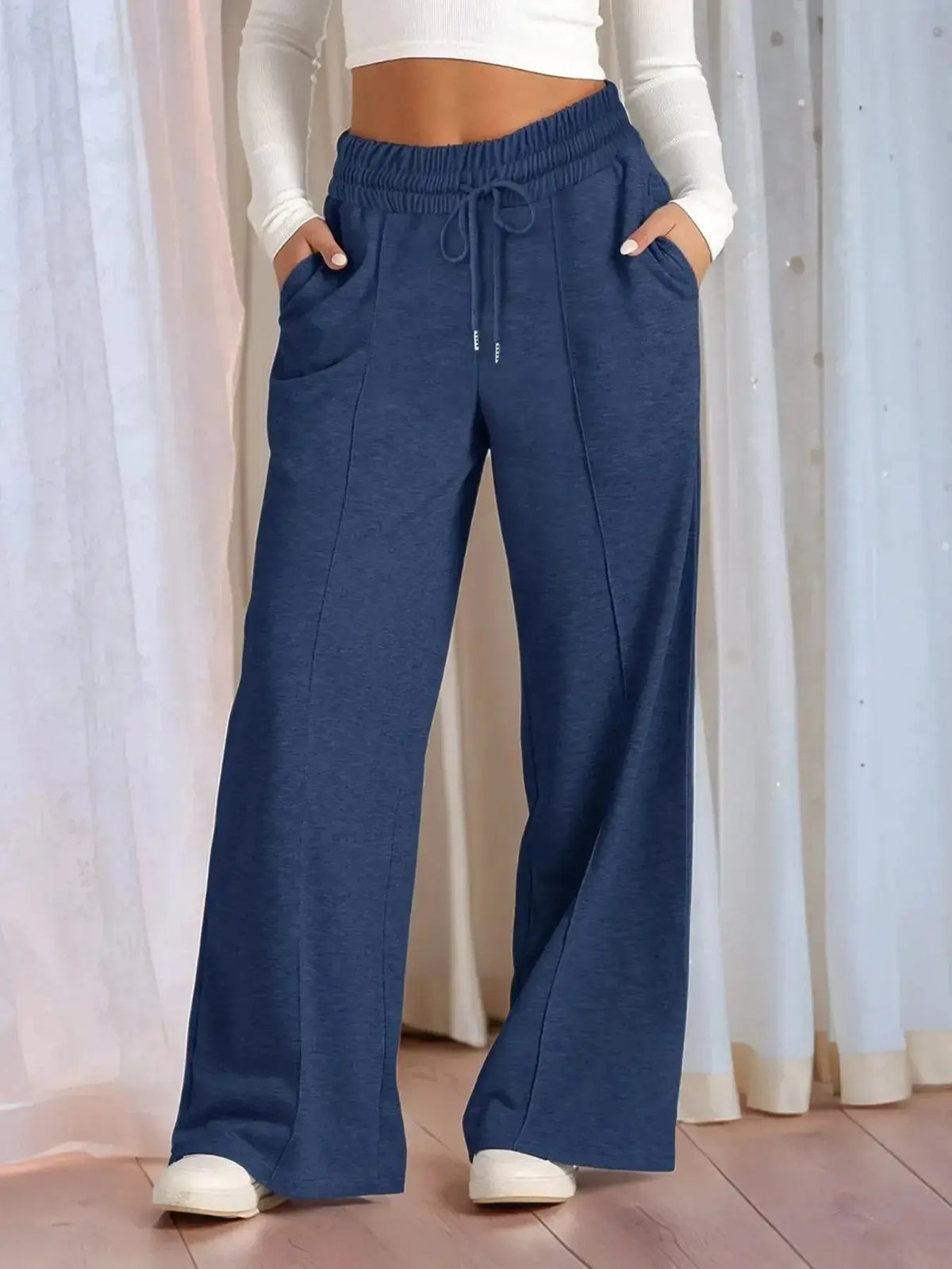 Plus size women's relaxed fit wide leg lounge pants with drawstring waist from Plush Fashion Hub, shown in a full view.