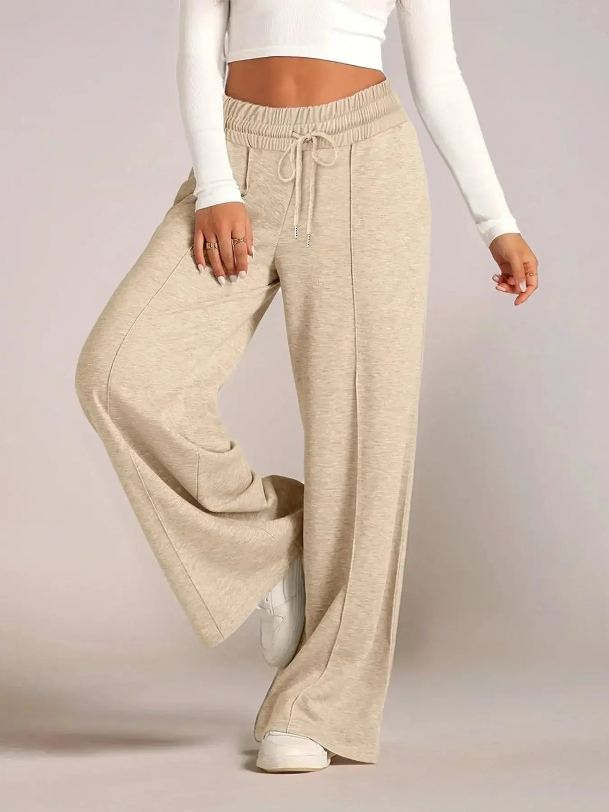 Plus size women's relaxed fit wide-leg lounge pants with drawstring waist from Plush Fashion Hub, shown in full length.