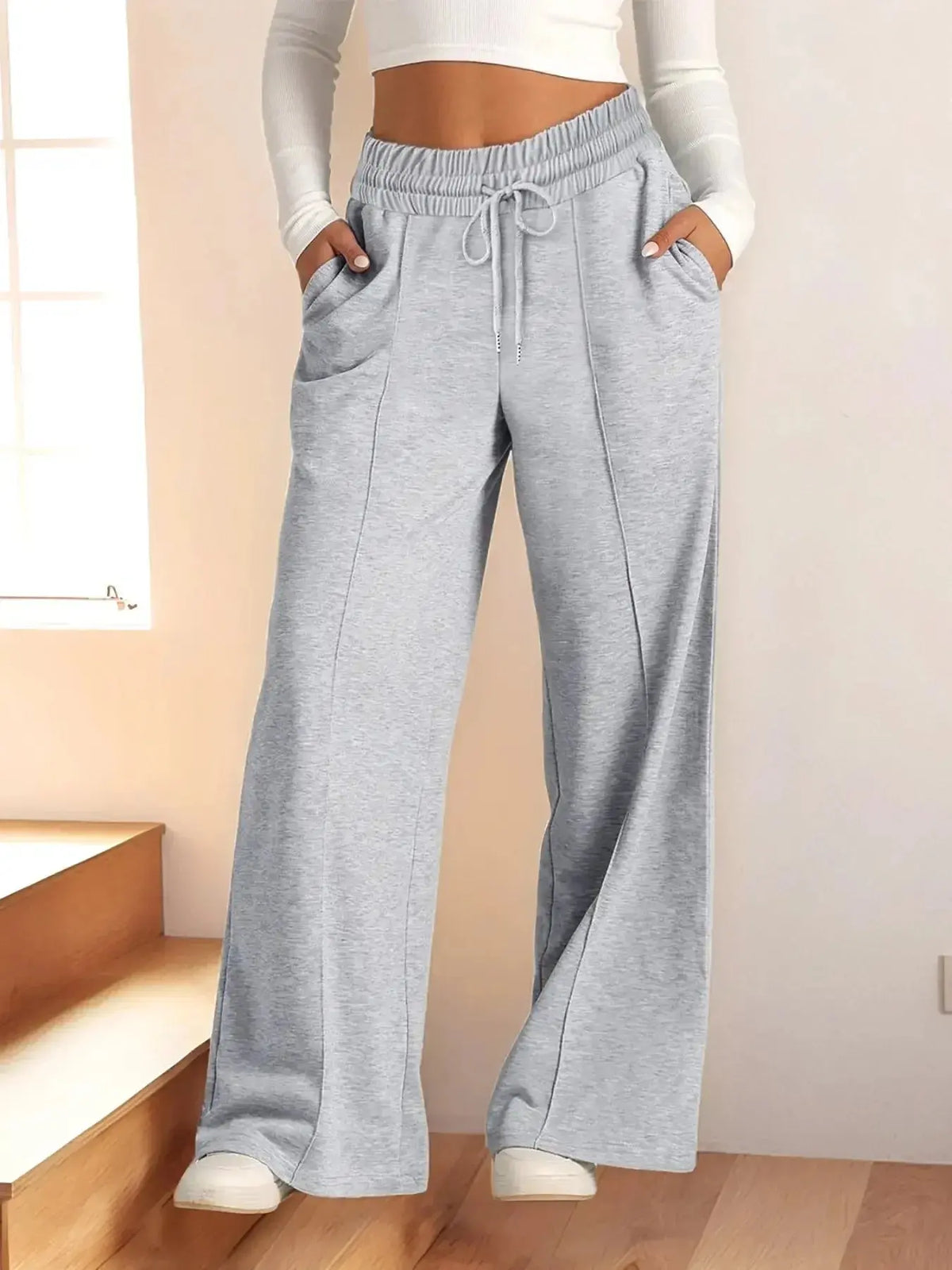 Plus size women's relaxed fit wide leg lounge pants with drawstring waist from Plush Fashion Hub, shown full length on model.