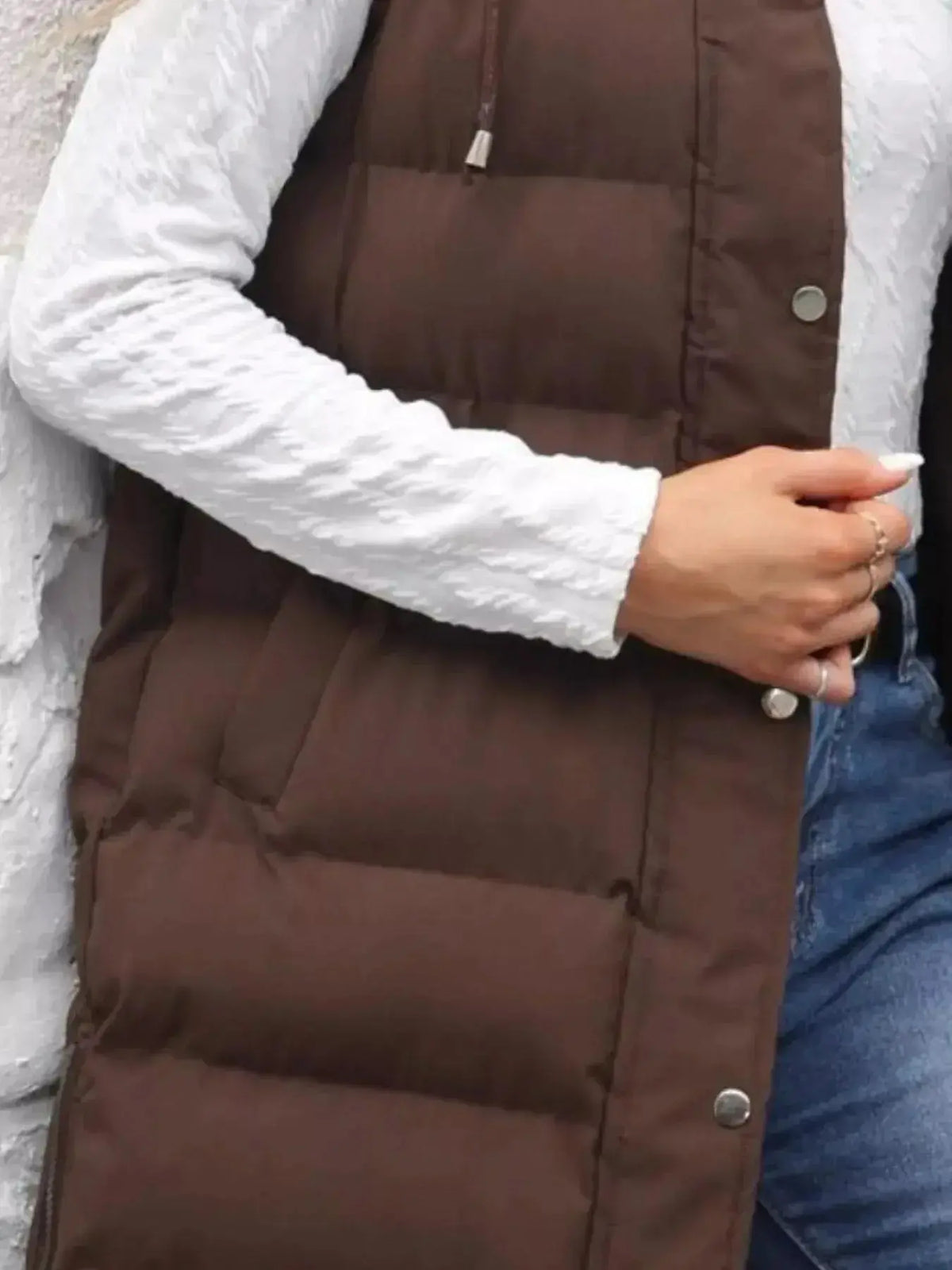 Full-length women's padded hooded vest by Plush Fashion Hub, lightweight sleeveless jacket with snap-down hood for added warmth.