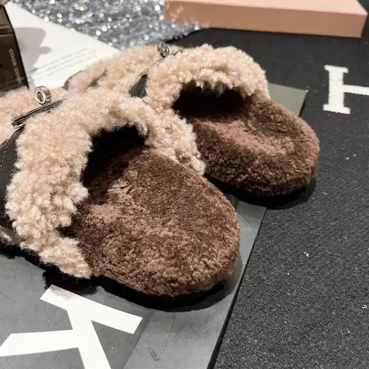 Fuzzy faux fur buckle slippers from Plush Fashion Hub featuring plush material and a stylish buckle accent.