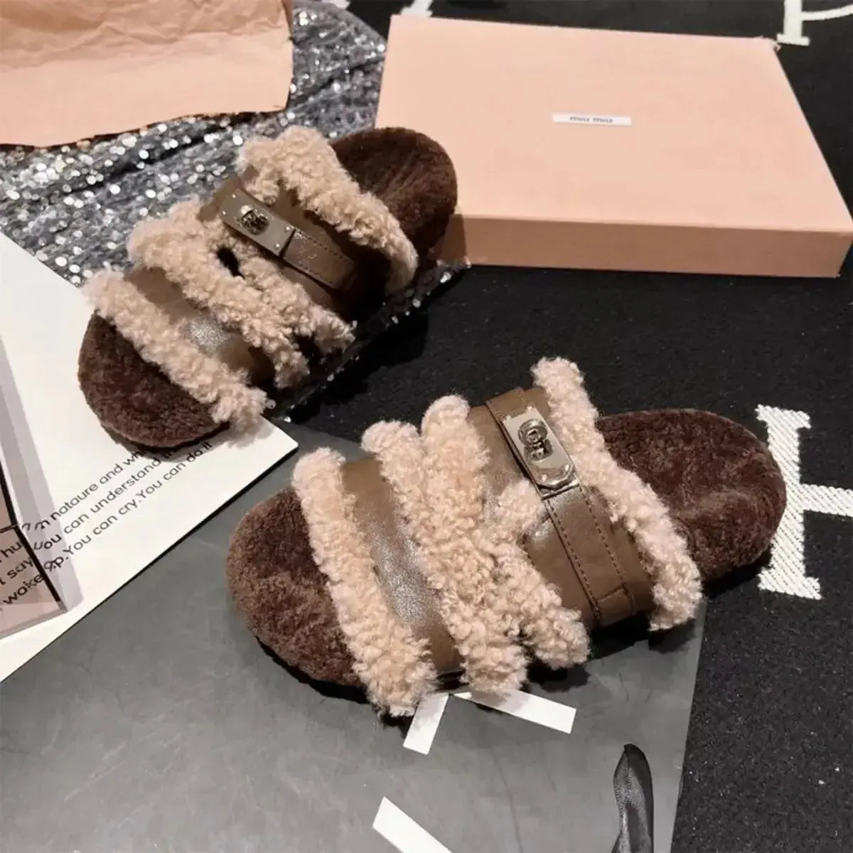 Fuzzy faux fur slippers with buckle accent from Plush Fashion Hub, featuring plush material and comfortable slip-on design.