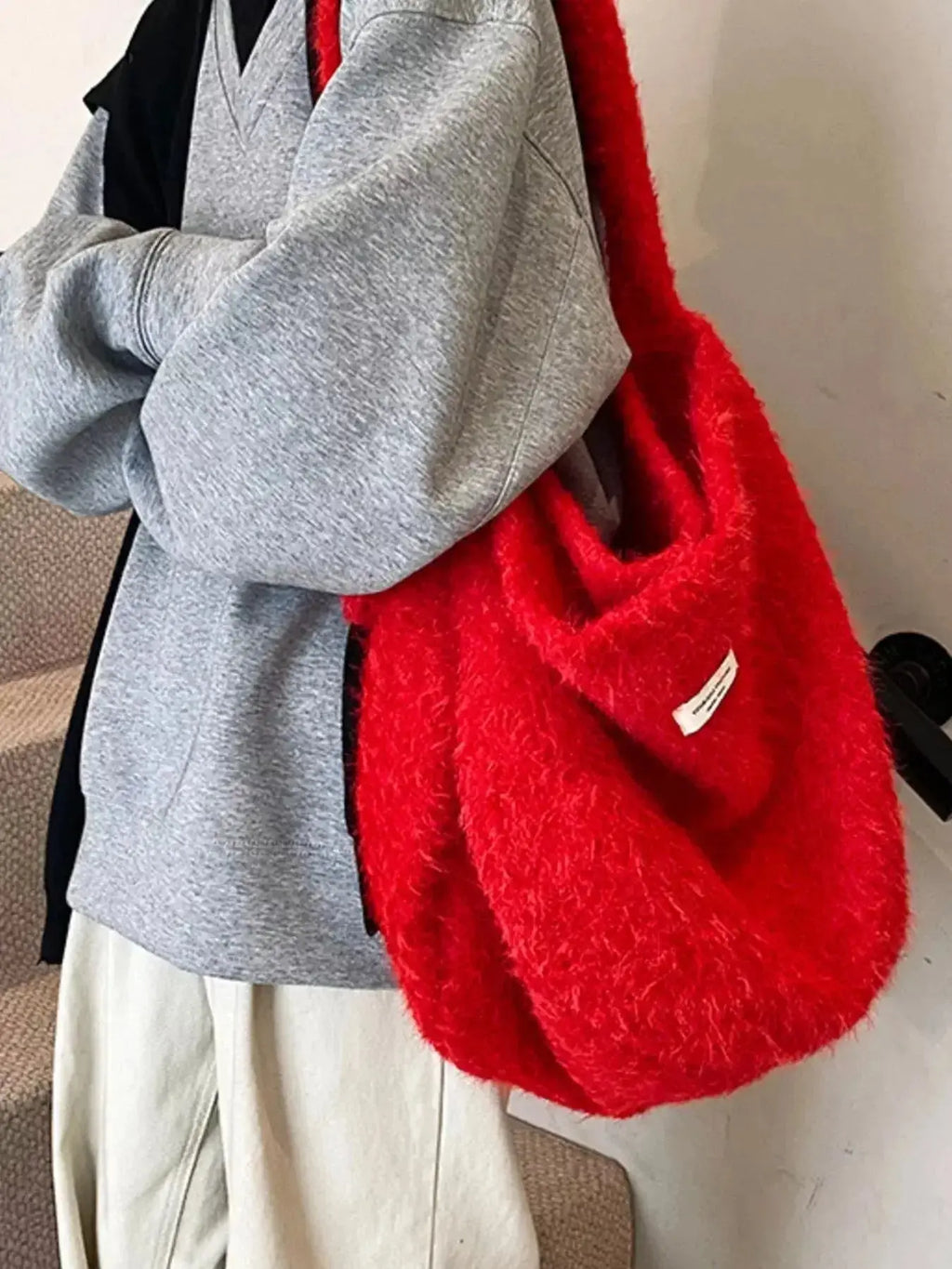 Soft fuzzy solid color crossbody bag from Plush Fashion Hub featuring plush material and a sleek, casual design.