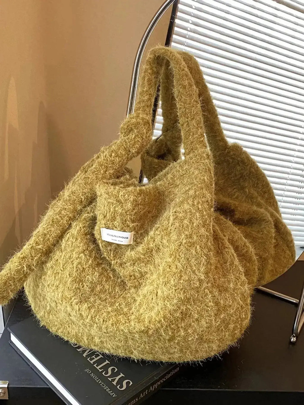 Fuzzy solid color crossbody bag from Plush Fashion Hub with plush texture and slim strap, perfect for casual wear.